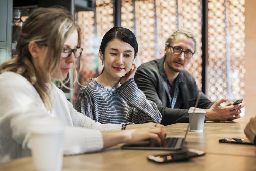 Free Image of Multiethnic colleagues in a cafe 