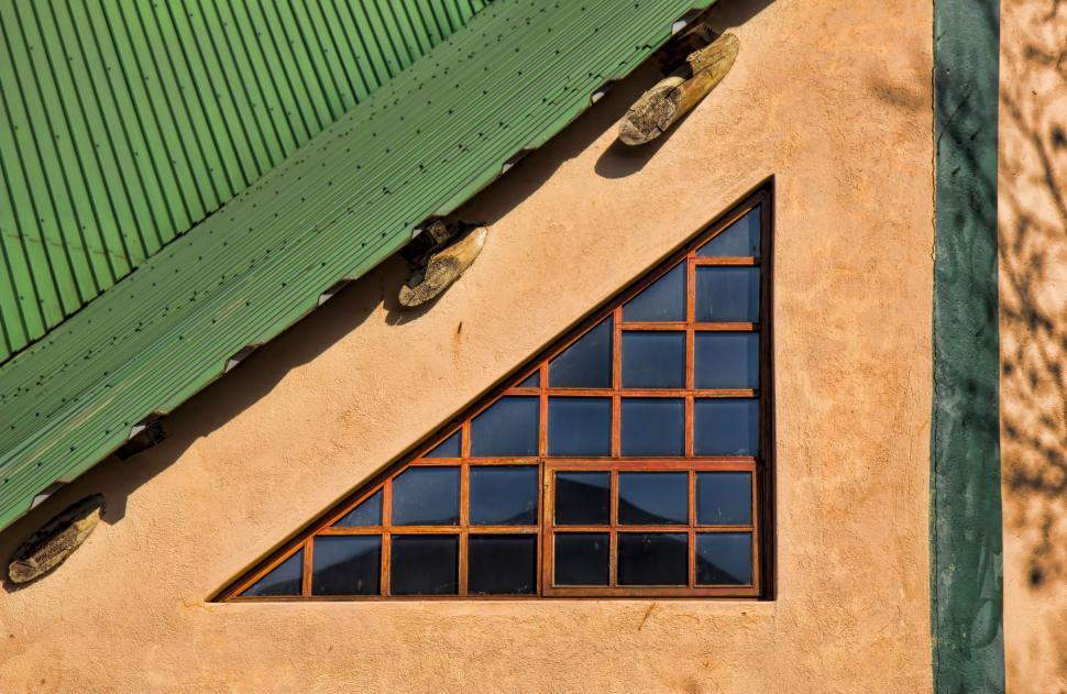 Free Image of Building With Green Roof and Two Windows 