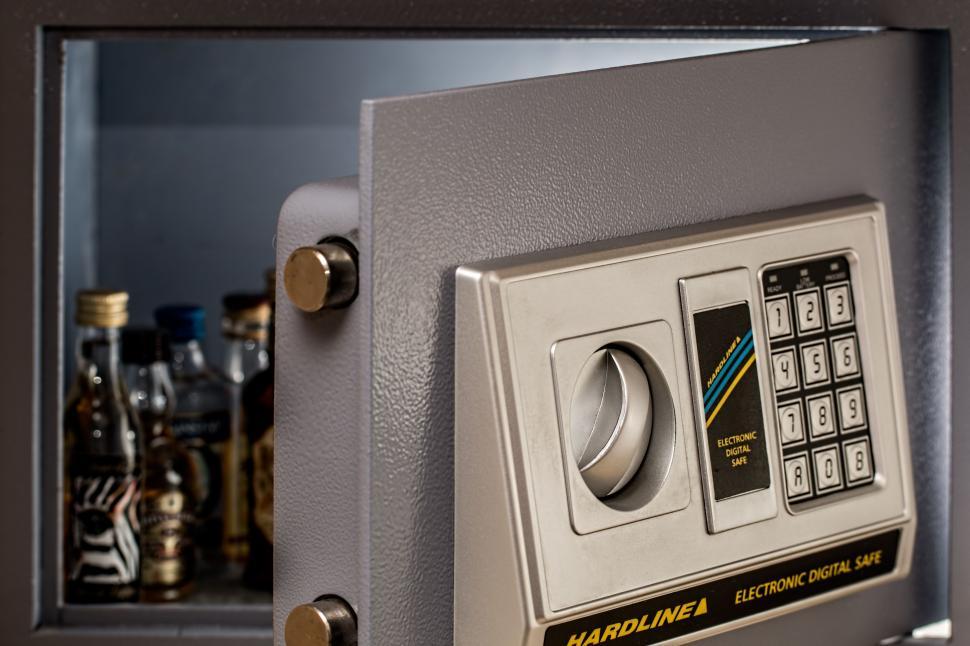 Free Image of Close Up of Safe With Bottles in Background 