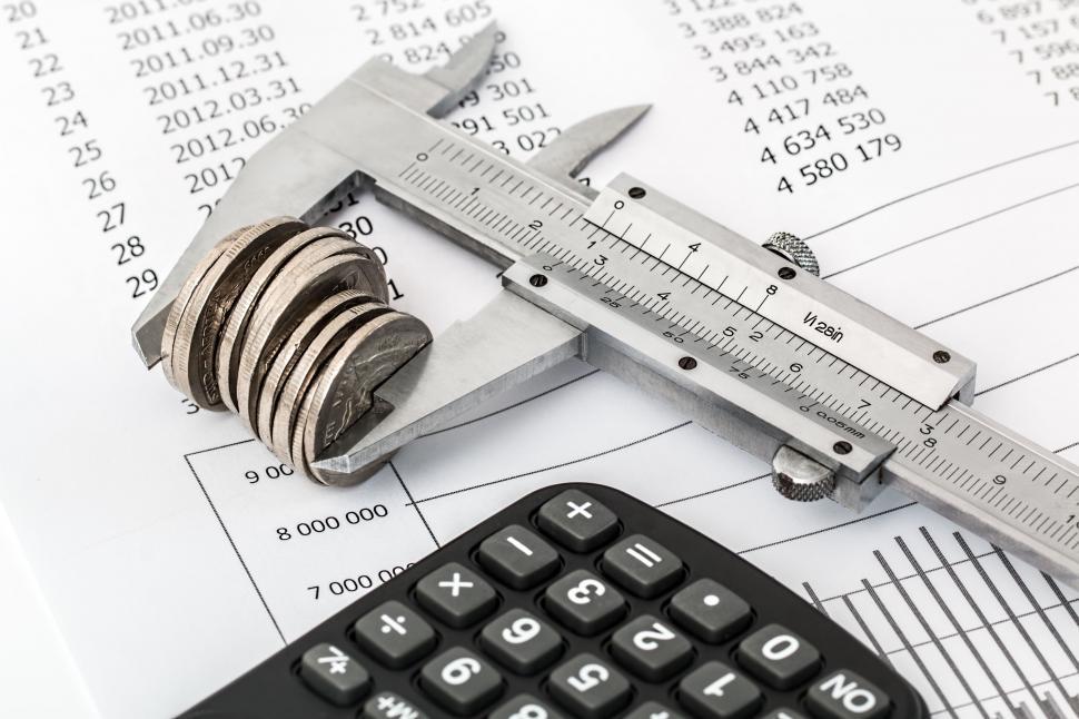 Free Image of Calculator, Tape Measure, and Pencil on Desk 