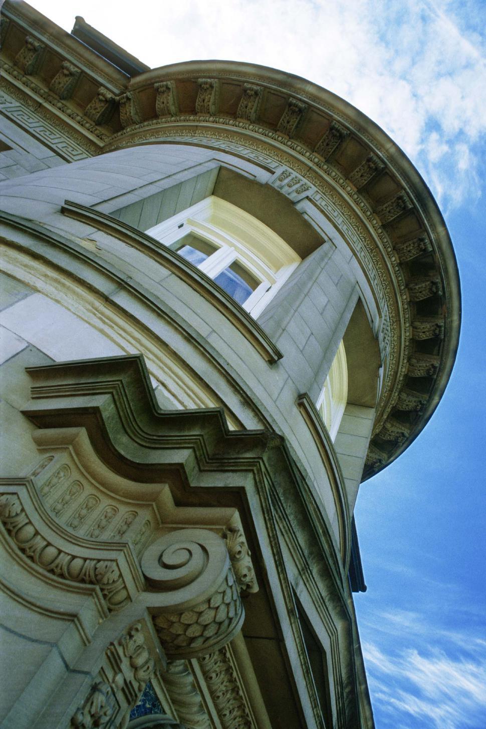 Free Image of Old Style Architecture House With Stone Carved Columns and Sky 