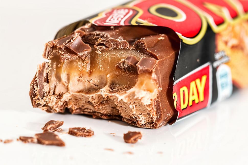 Free Image of Close Up of Chocolate Bar With Bite Taken Out 