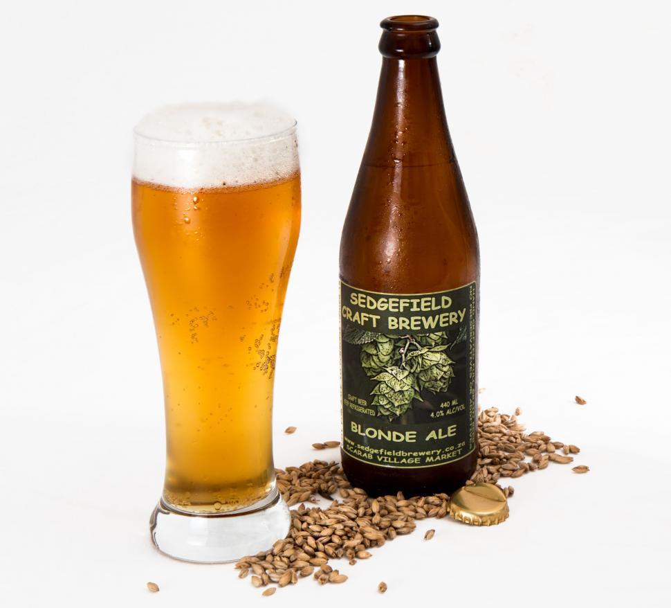 Free Image of Glass of Beer Next to Bottle of Beer 