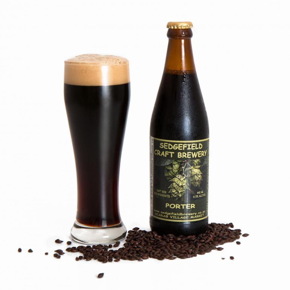 Free Image of Glass of Beer Next to Bottle of Beer 