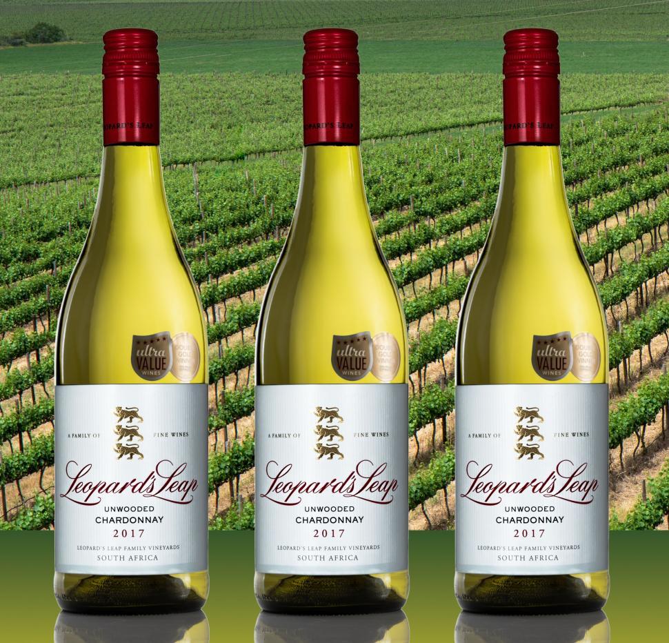 Free Image of Three Bottles of Wine Aligned Together 