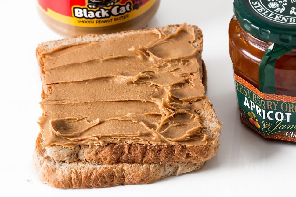 Free Image of Peanut Butter and Jelly Sandwich on White Surface 