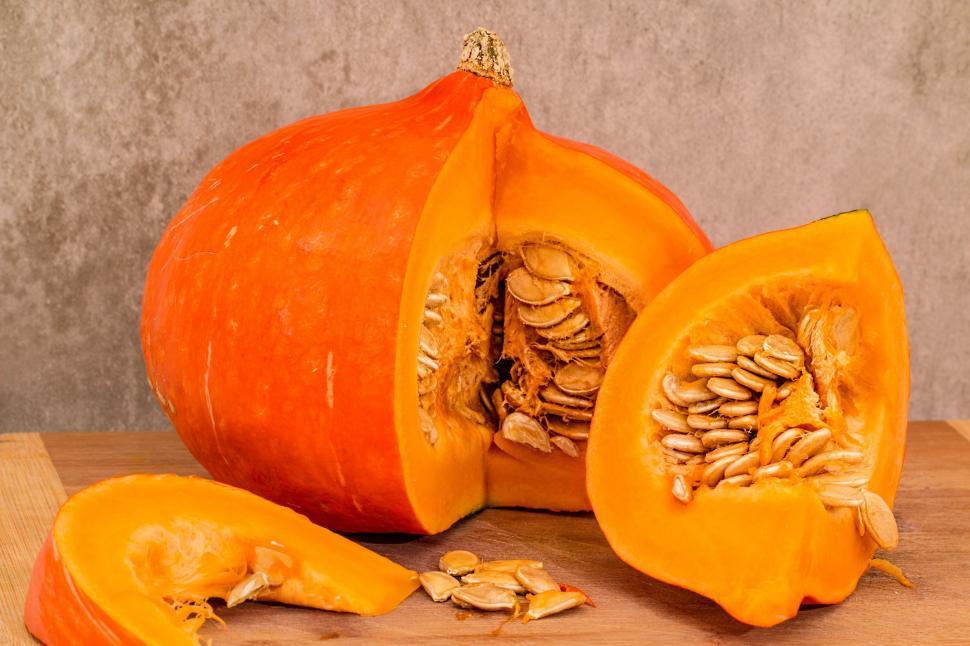 Free Image of Pumpkin Halved on Cutting Board 