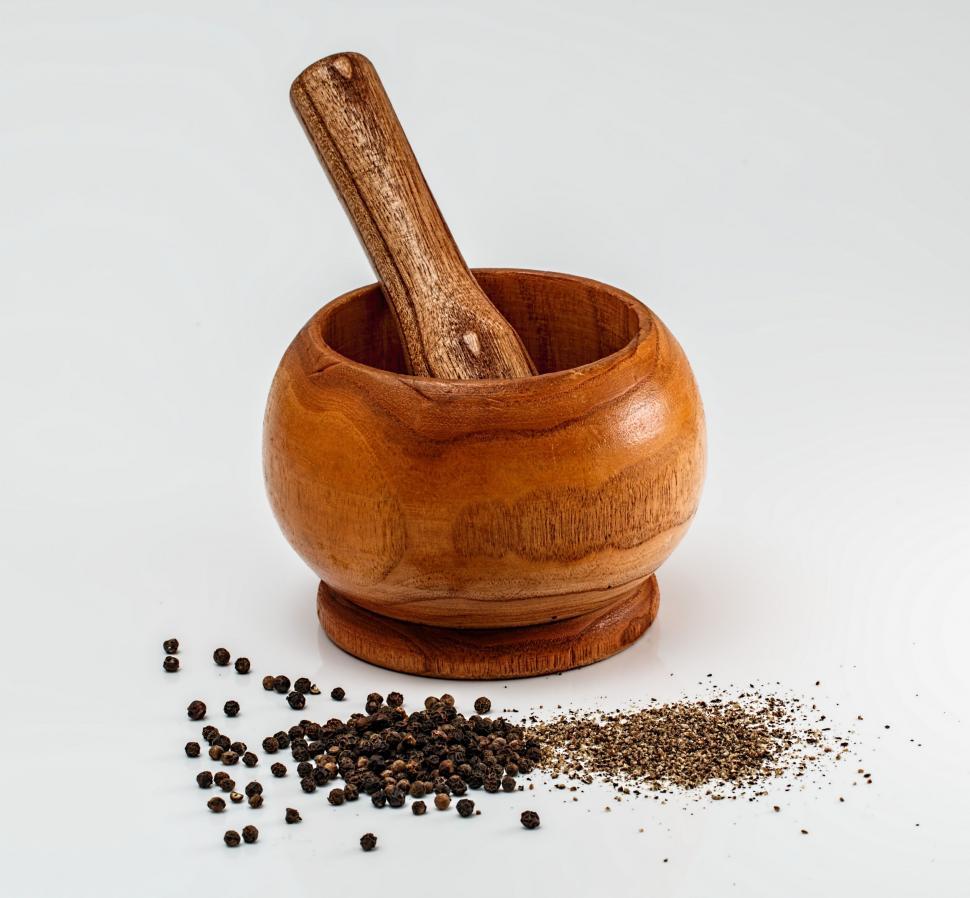 Free Image of Wooden Mortar and Spoon on White Background 