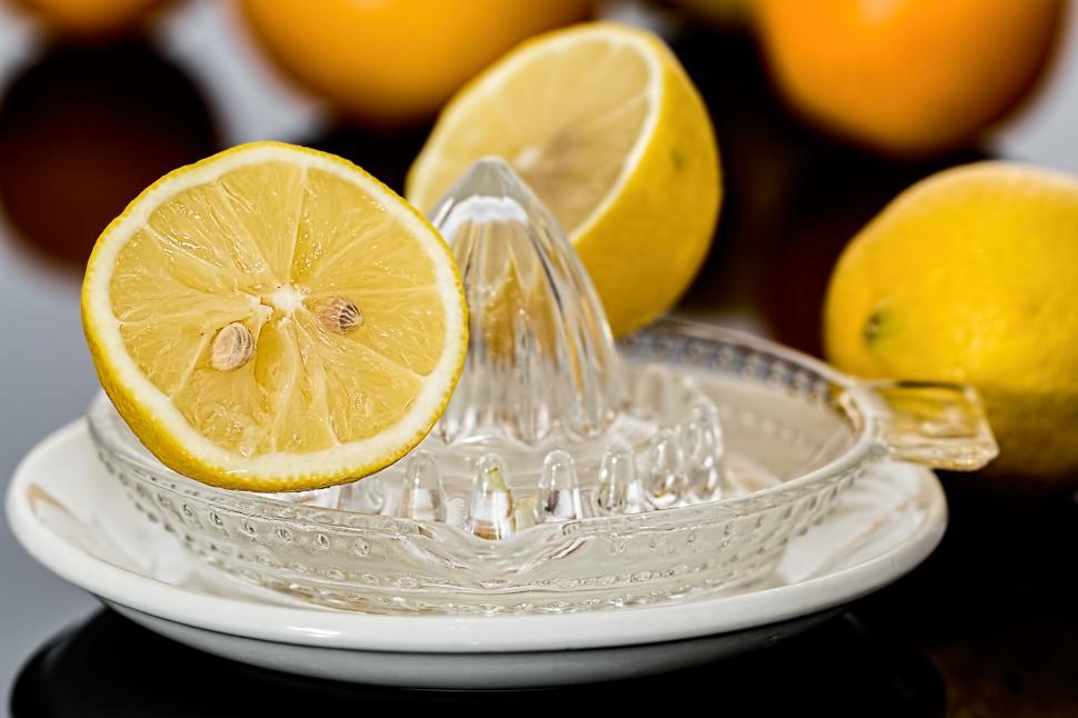 Free Image of Lemons on Plate Beside Water Fountain 