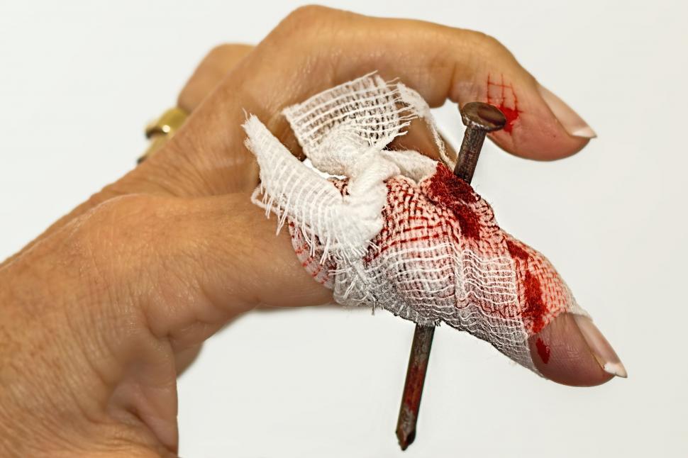 Free Image of Hand Holding Cloth With Knife 