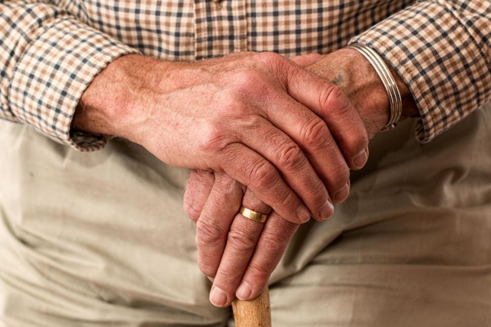 Free Image of Old Man Holding Walking Stick 