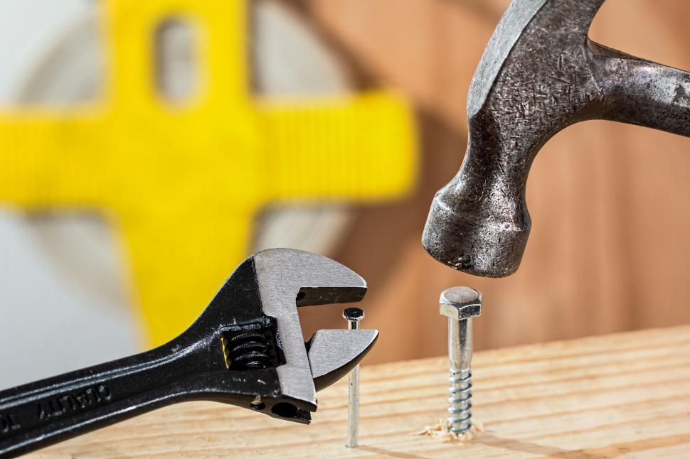 Free Image of Hammer and Screws on Table 