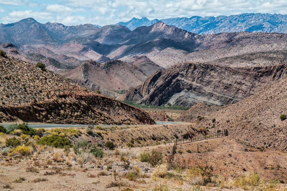 Free Image of Majestic Mountains and Winding Road 