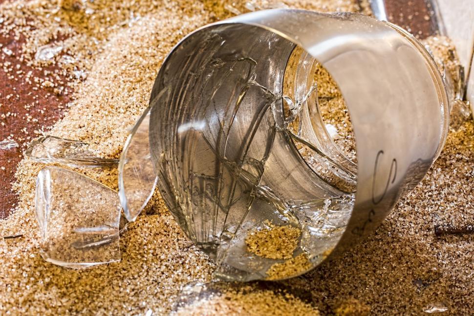 Free Image of Glass Filled With Sand on Floor 