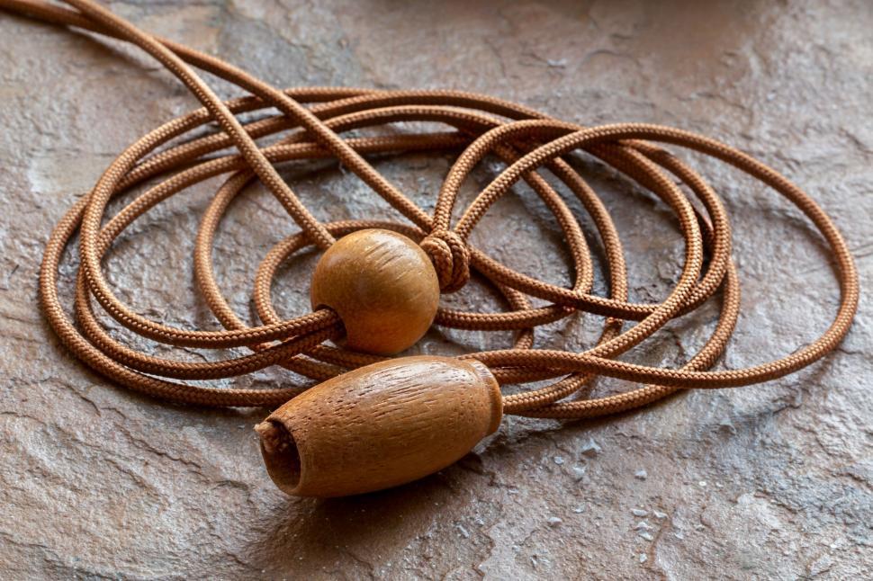 Free Image of Necklace Resting on Rock 