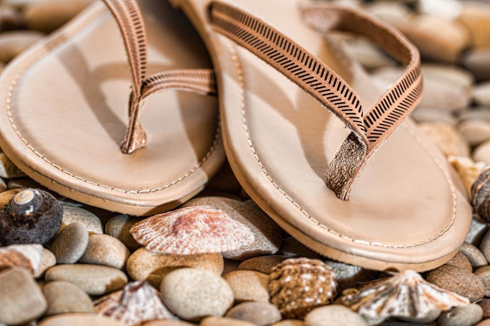 Free Image of Sandals on Pile of Rocks 