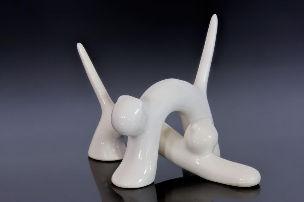 Free Image of White Ceramic Sculpture of a Person Laying Down 