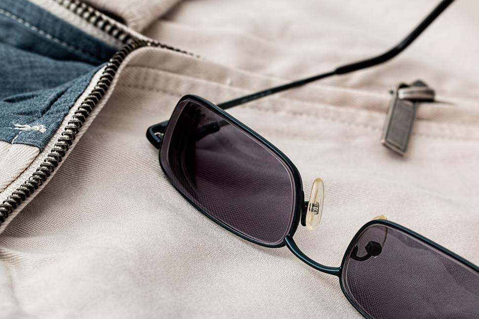 Free Image of Sunglasses on Top of Jeans 