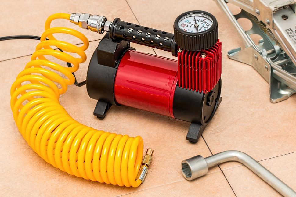Free Image of Red and Black Blow Dryer on Tile Floor 