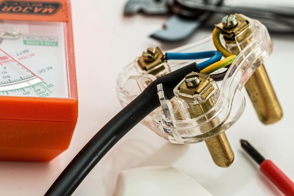 Free Image of A Couple of Wires Plugged Into a Device 