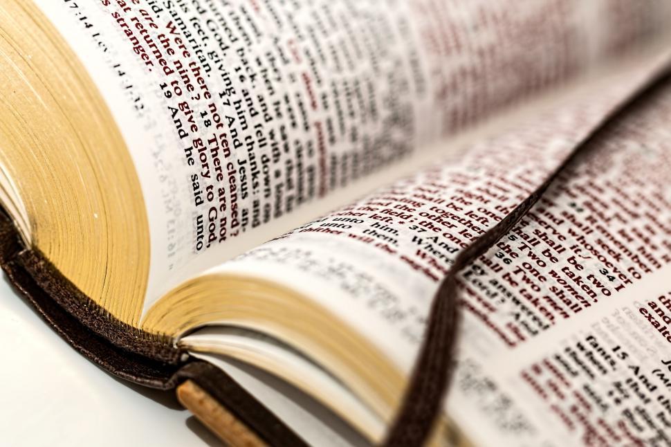 Free Image of Close Up of an Open Book on a Table 