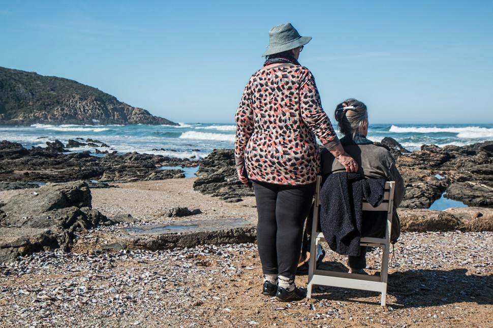 Free Image of Couple Standing on Beach 