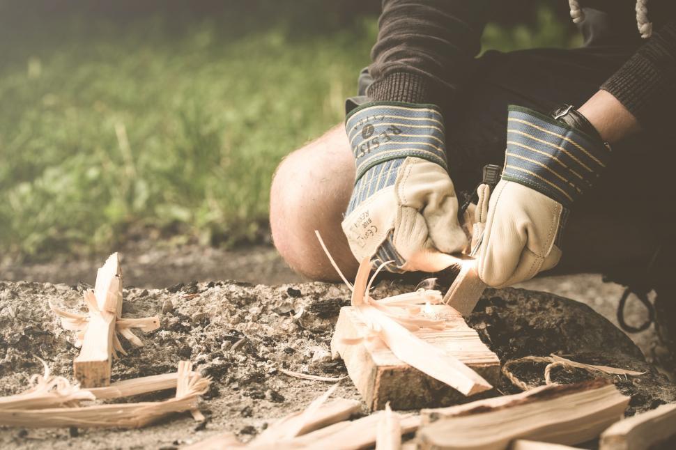 Free Image of Person Cutting Wood With Scissors 