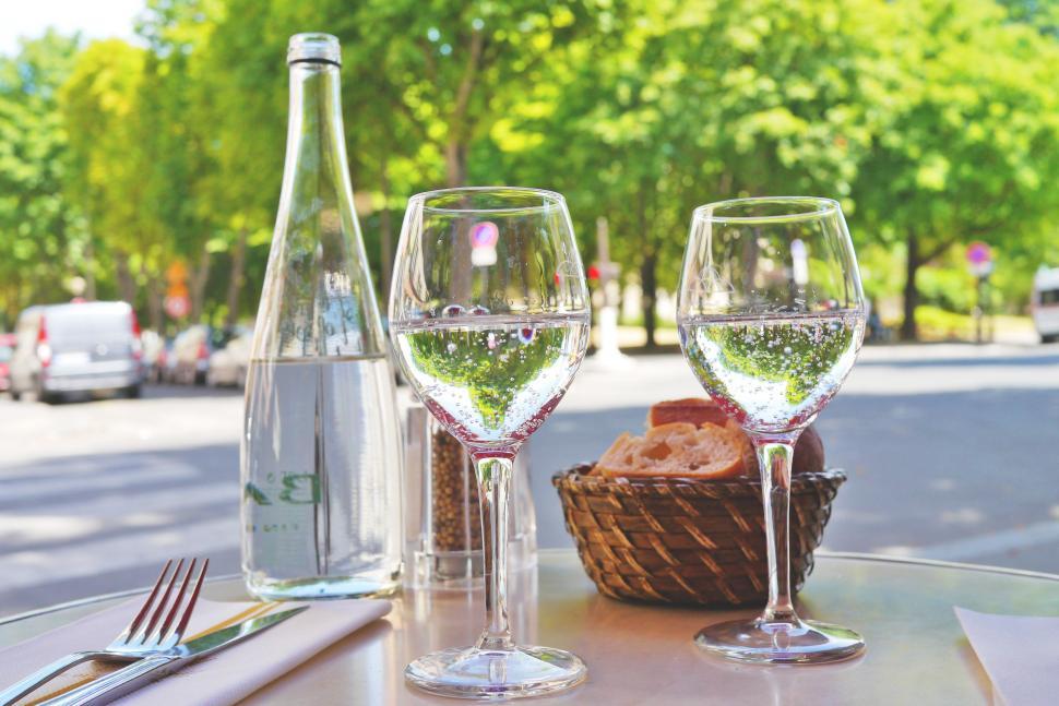 Free Image of Glasses of water with bread basket and cutlery  