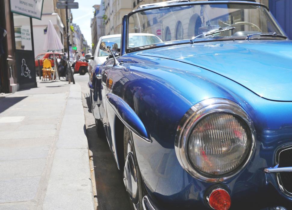Free Image of Vintage Mercedes parked on street in Paris  