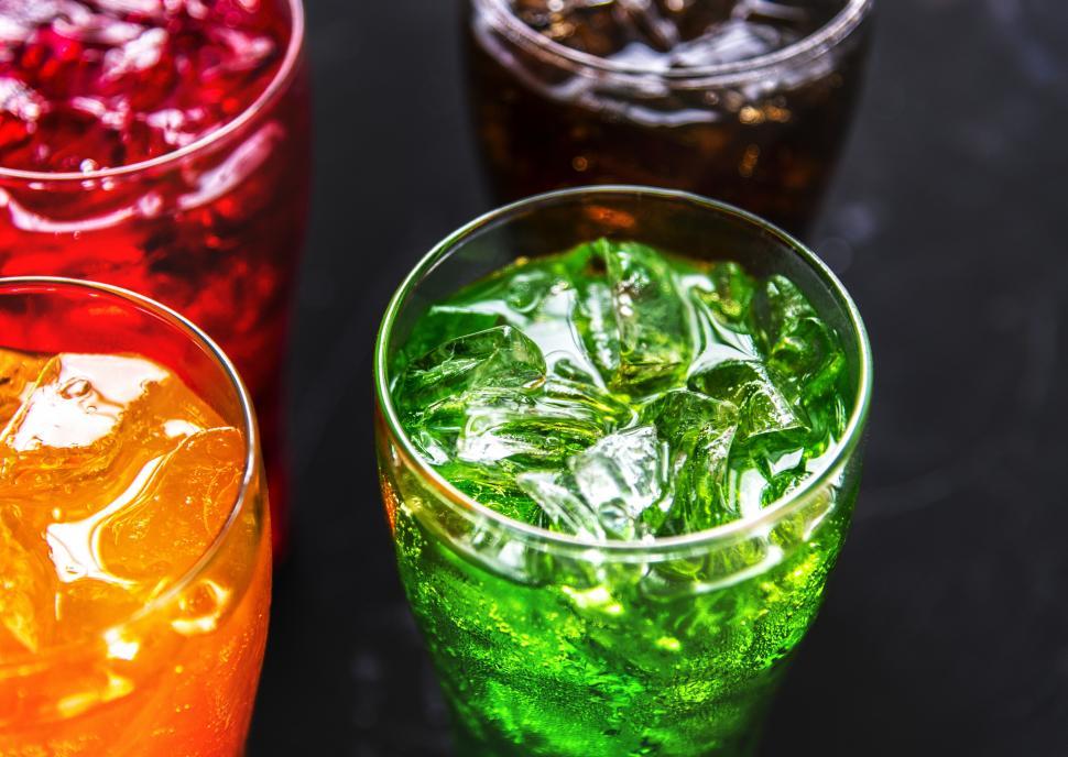 Free Image of Four colorful soft drinks in pint glasses 