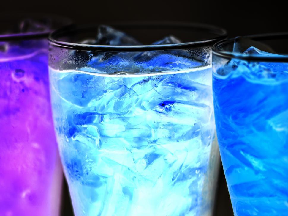 Free Image of Blue and purple soft drinks in pint glasses 