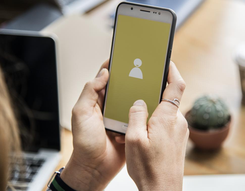 Free Image of Close up of a smart phone in a person s hands 