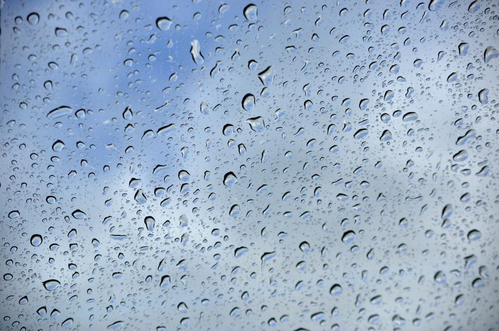 Free Image of Rain on window blue sky 