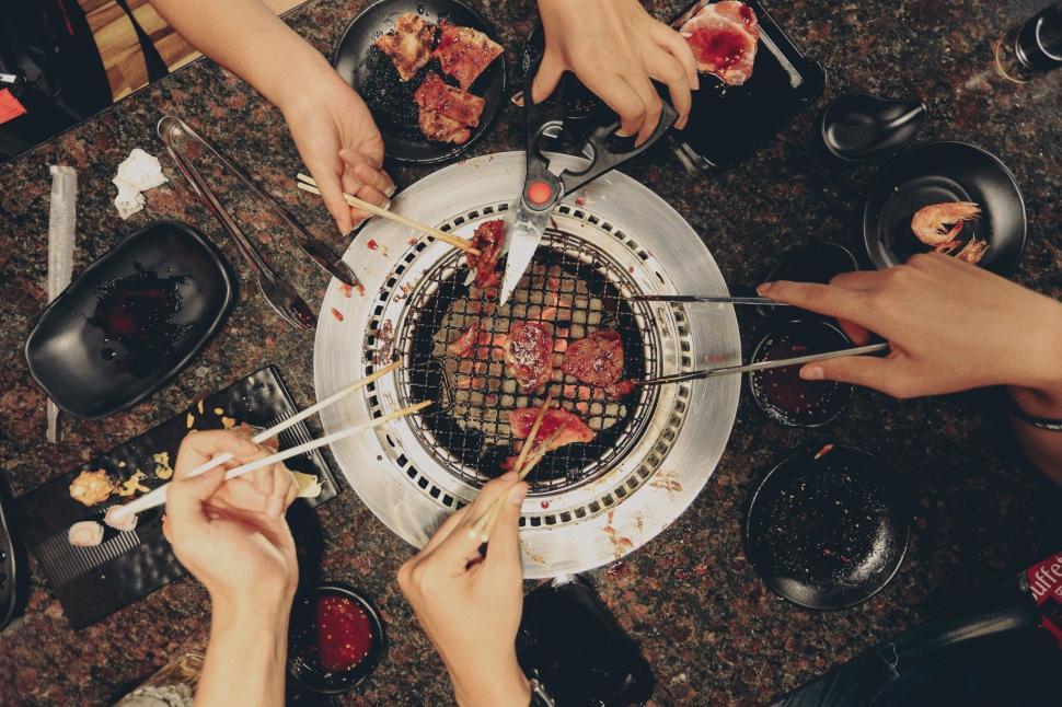Free Image of Hands and Grill Pork Chops  