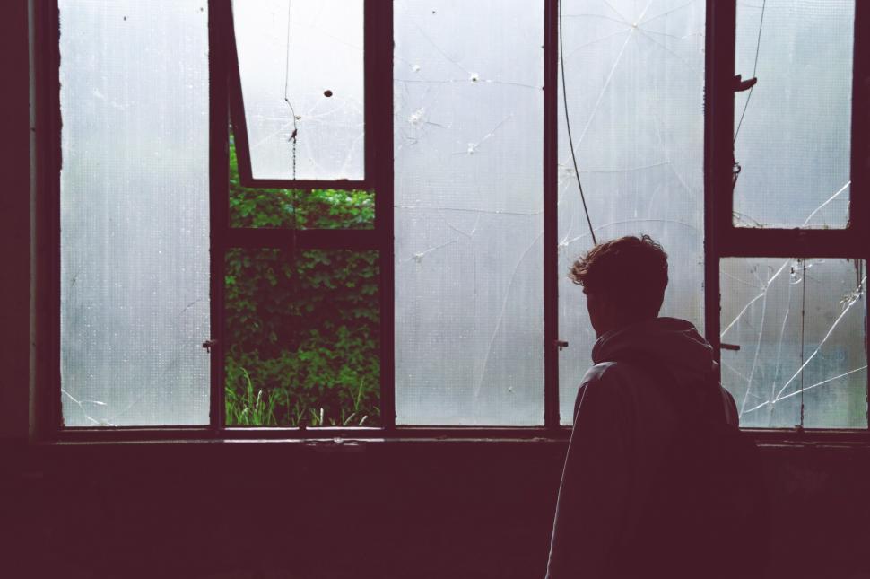 Free Image of Young Boy at window  