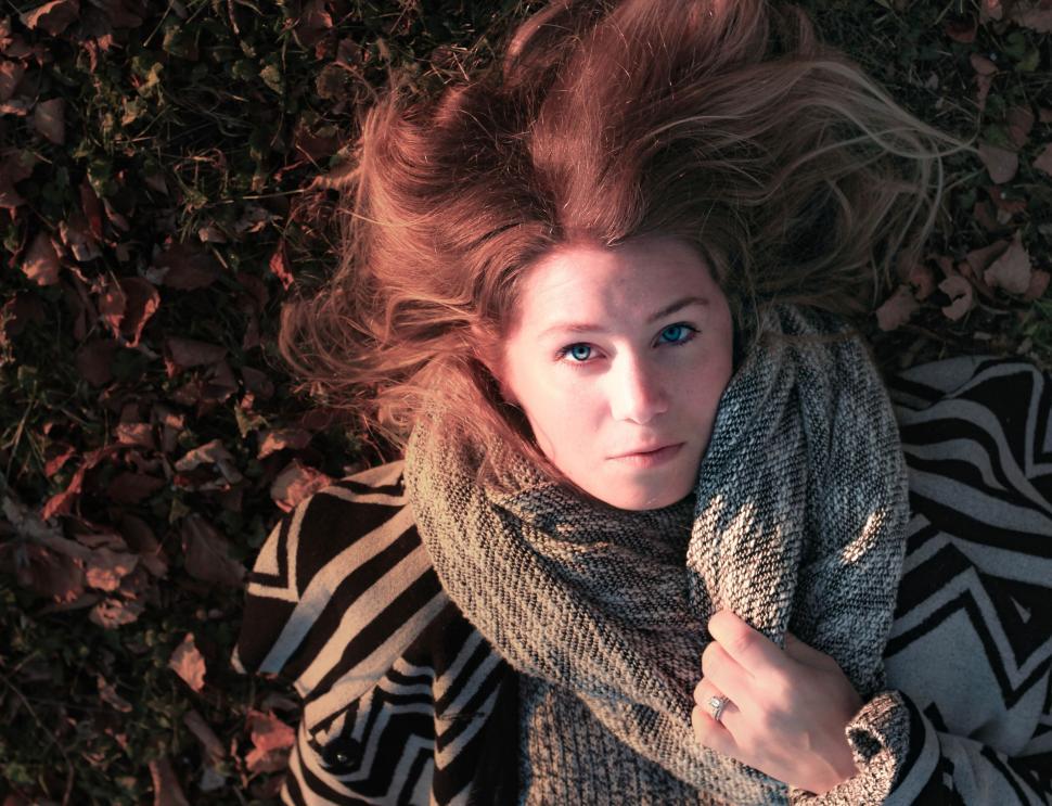 Free Image of Young Caucasian Woman Holding her muffler - eye contact  