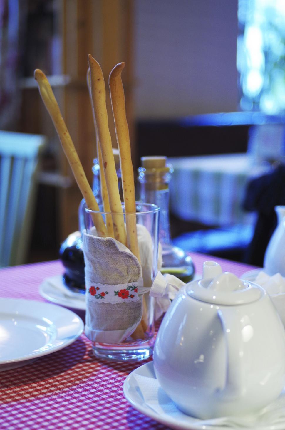 Free Image of Breadsticks in a glass tumbler 