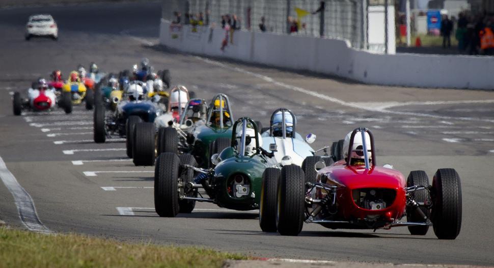 Free Image of Racing Cars on racetrack  