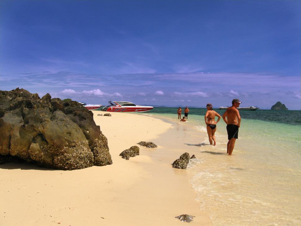 Free Image of Couple Walking on Beach 