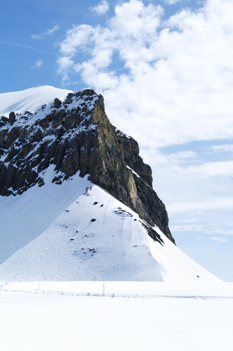 Free Image of Snow Covered Mountain Against Sky Background 