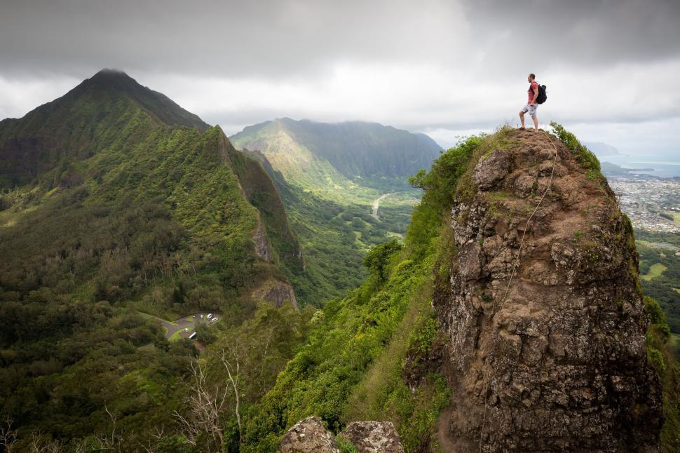 Free Image of Young Man on Cliff  