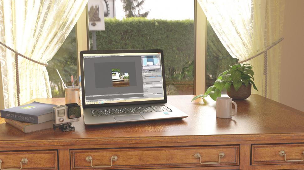 Free Image of Laptop near window  