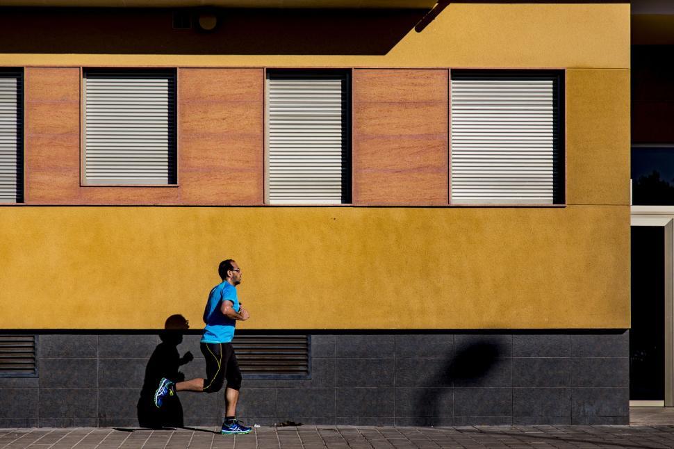 Free Image of Male Jogger on sidewalk  
