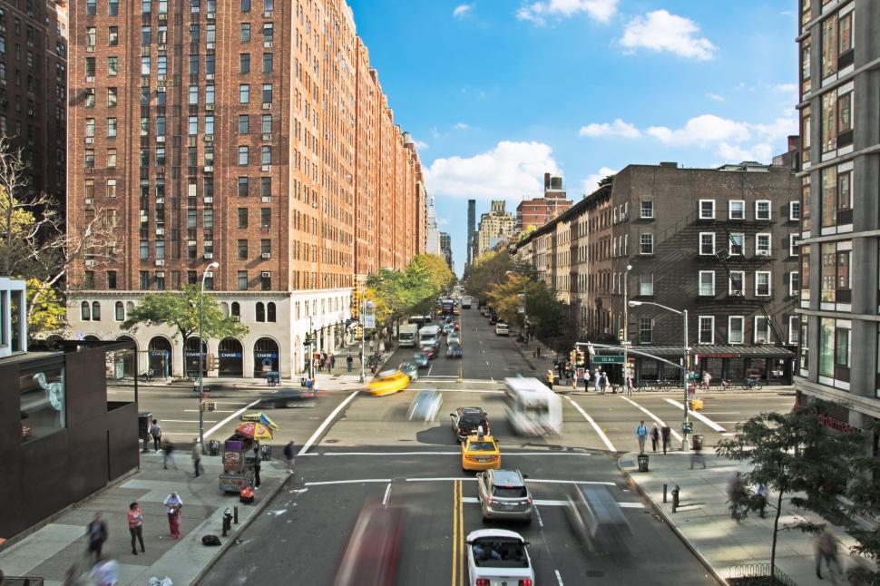 Free Image of Traffic on road with buildings - Speed Effect  