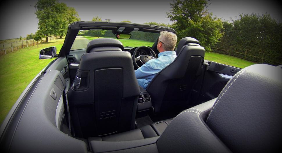 Free Image of Old Man driving Mercedes Benz 