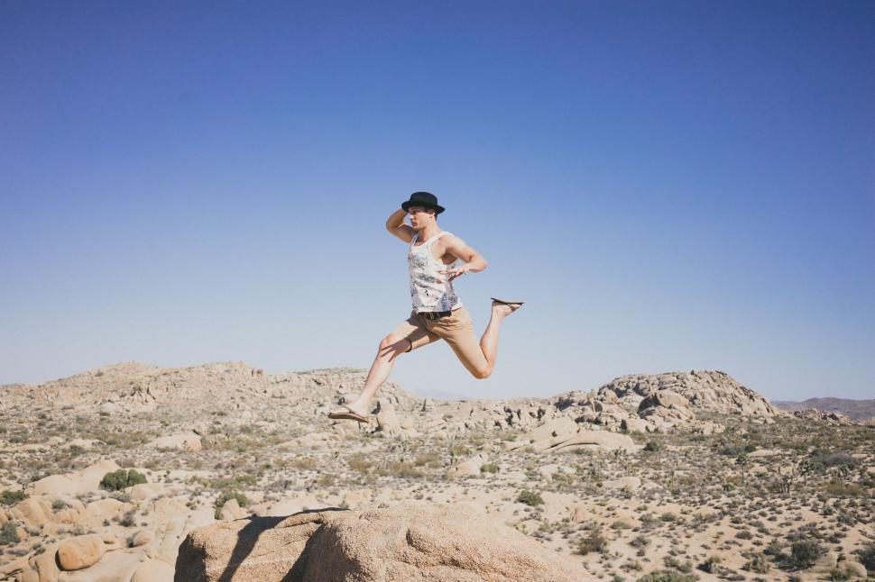 Free Image of Man Jumping on desert  
