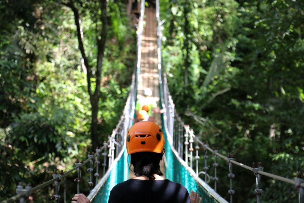 Free Image of Orange Helmet Man On Bridge  