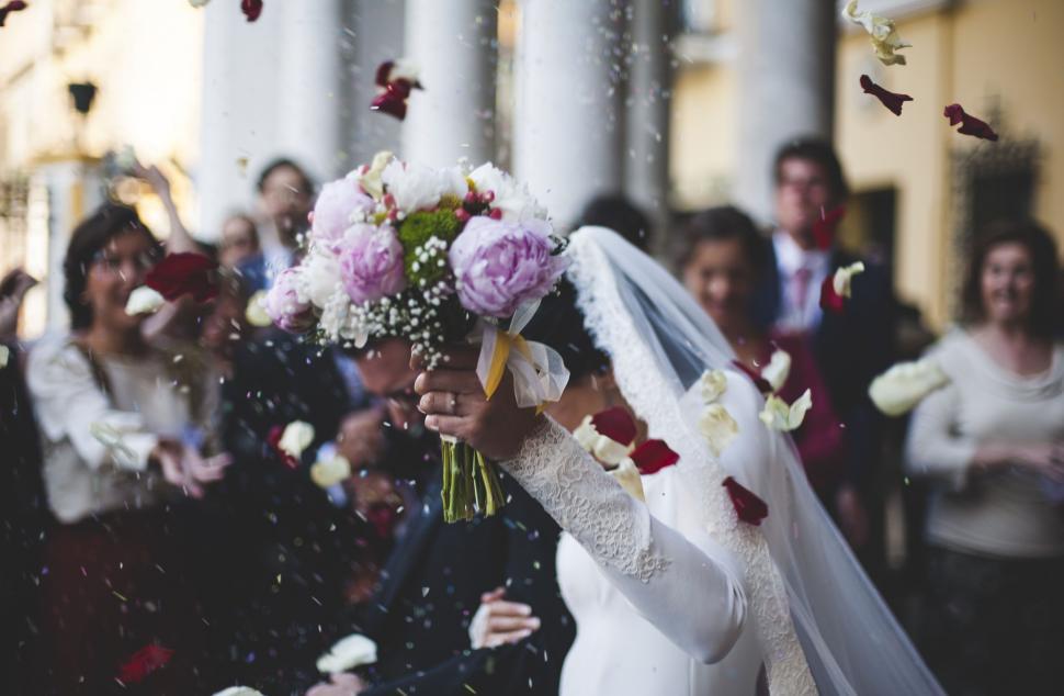Free Image of Bride and Groom With Wedding Bouquet  