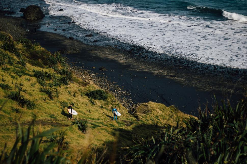 Free Image of Two Surfers with Board  