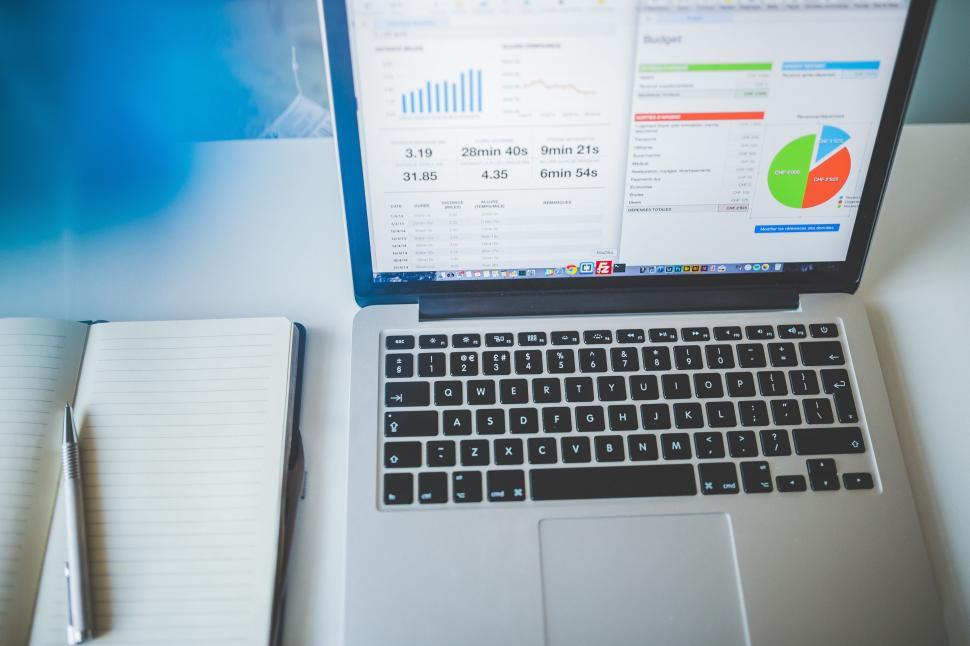 Free Image of Laptop with Notebook and Pen  